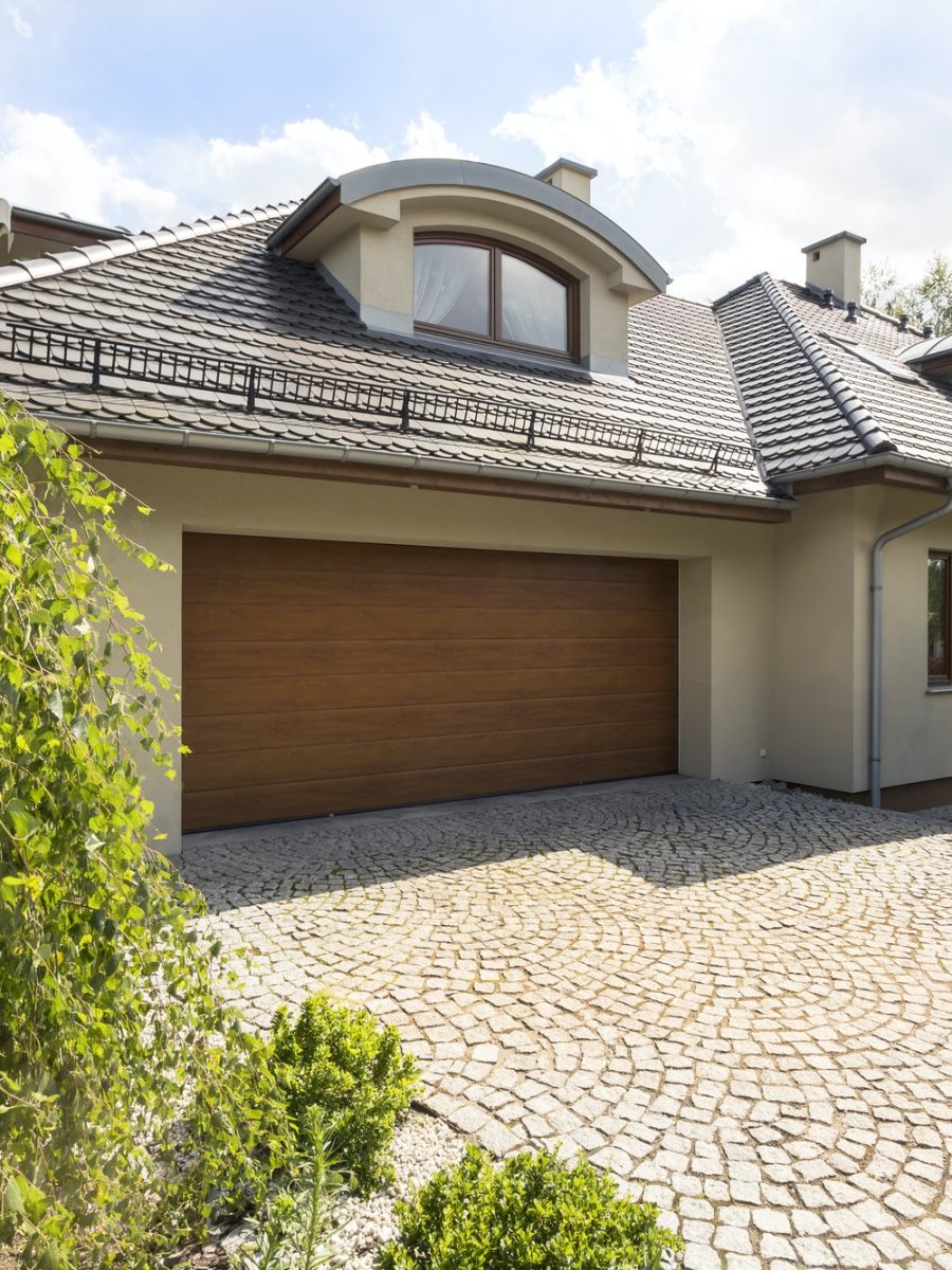 Detached house exterior with cobblestone driveway